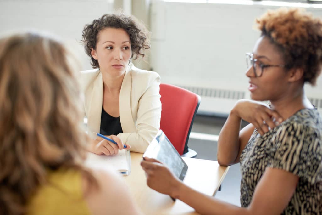Three business women in a meeting